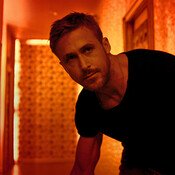 ryan_gosling_mysterious_muscle_orange_room_light_on.jpg